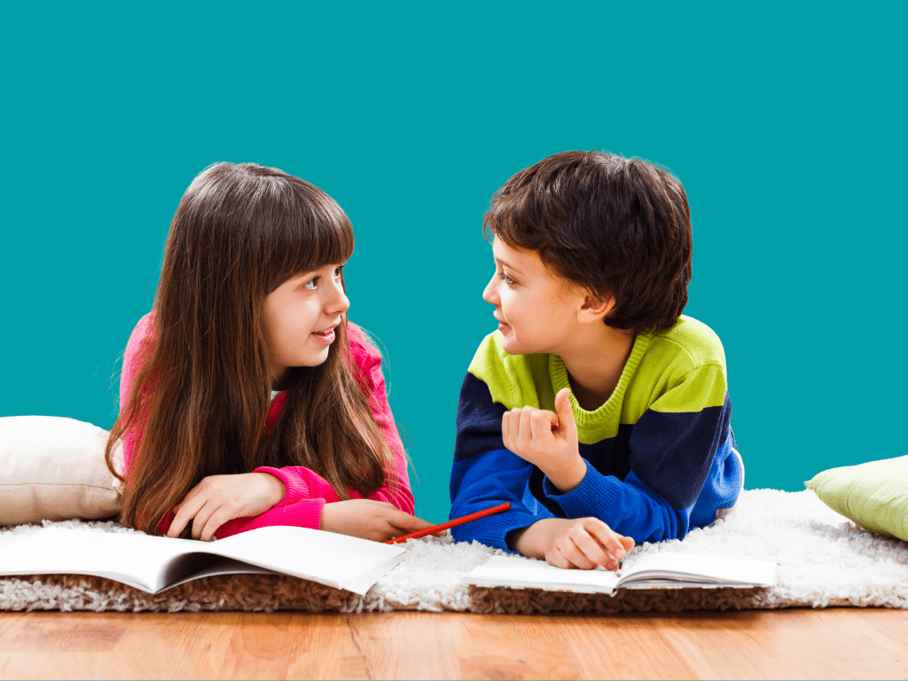Two or three children talking and playing together, smiling and engaged, symbolizing how speech supports social connection and reduces feelings of isolation.”