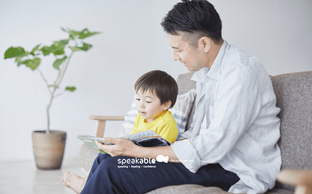 Parent and child sharing a book together during their evening reading routine.