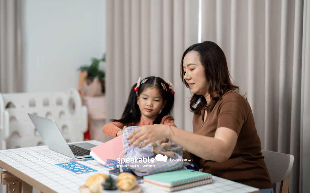 A child organizing their school bag with a parent’s help — building focus and planning skills.