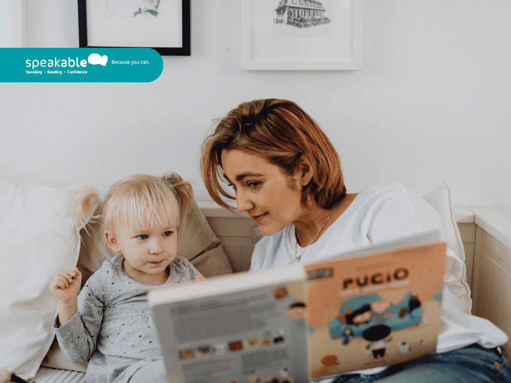 parent reading a colourful storybook with a young child — building early vocabulary through play.