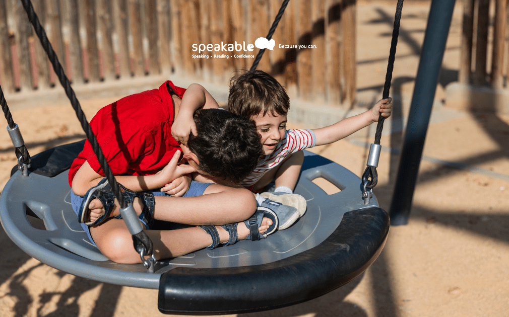 Two children talking and playing together during school recess.