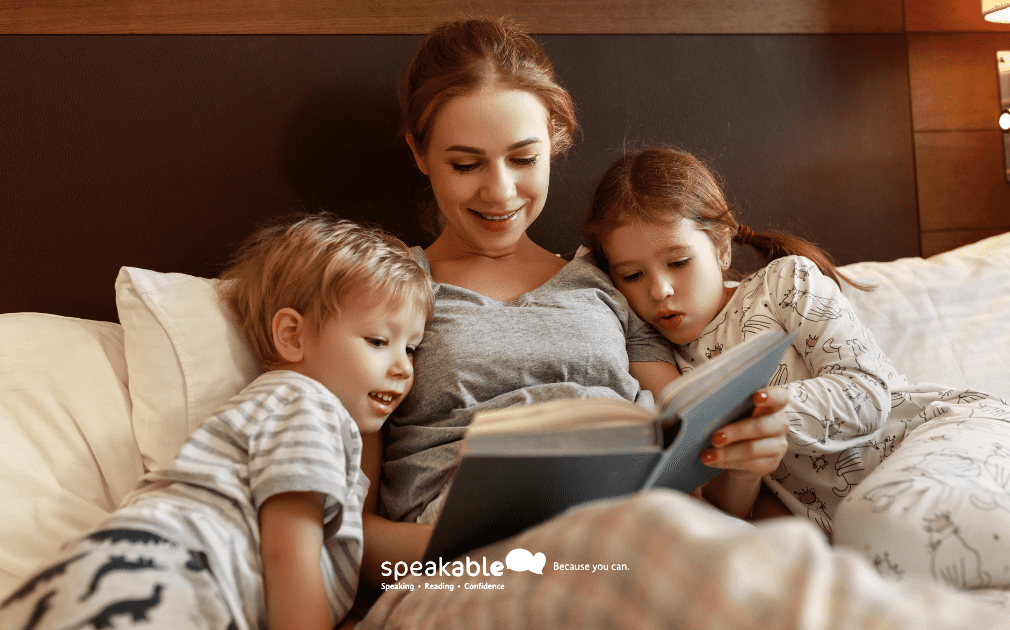 Parent reading a storybook with a child during a relaxed bedtime routine.