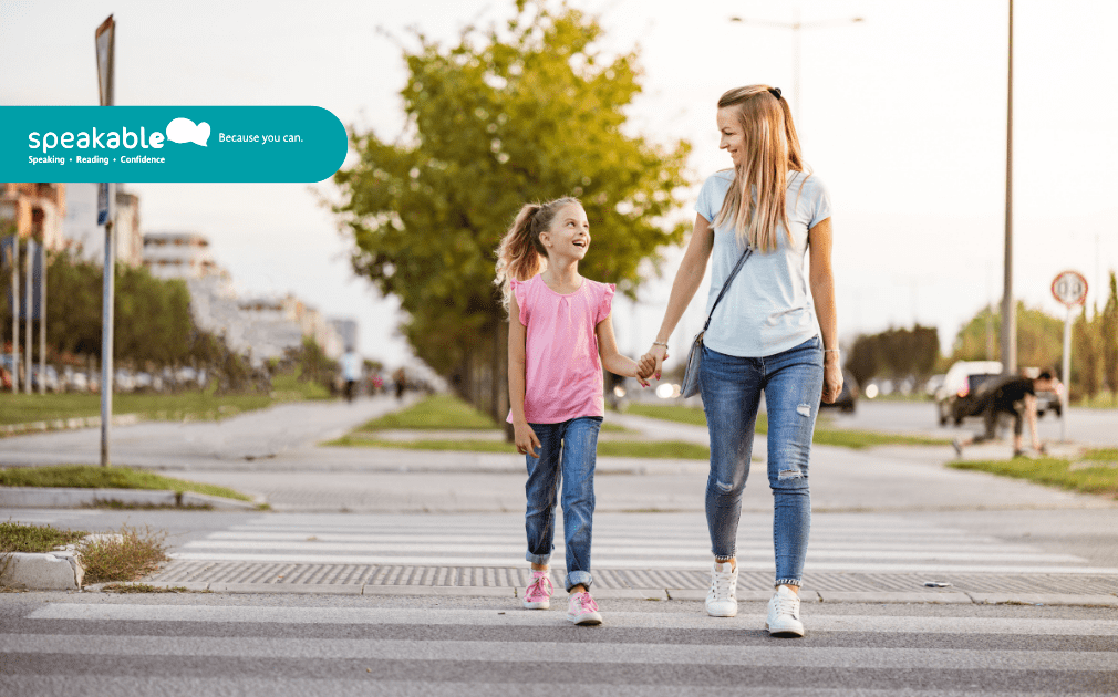 Child building confidence through supportive communication with an adult.