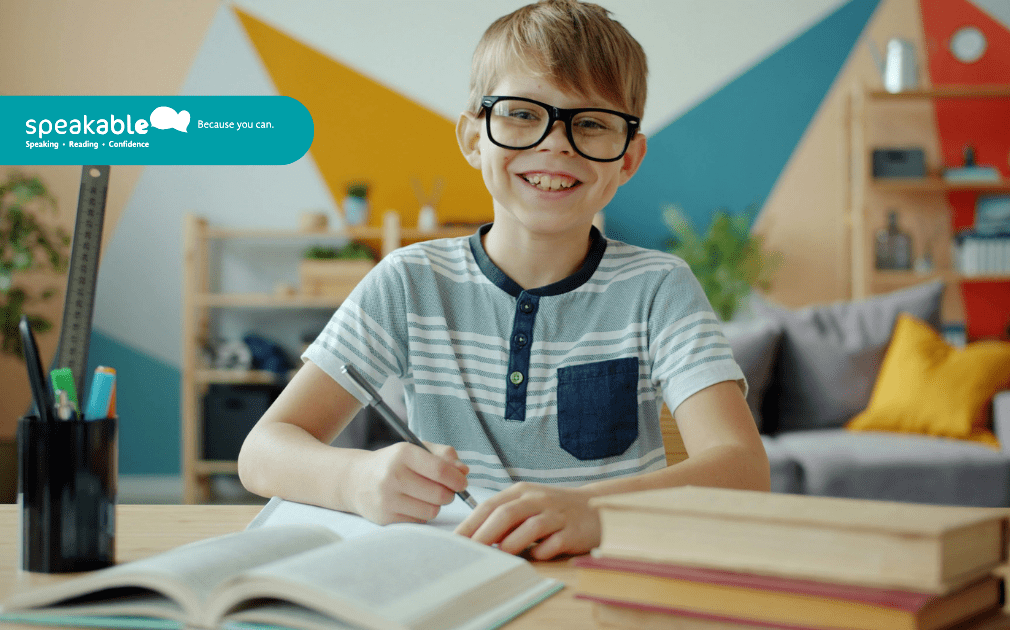 Child engaging in speech therapy while using visual supports to express ideas.