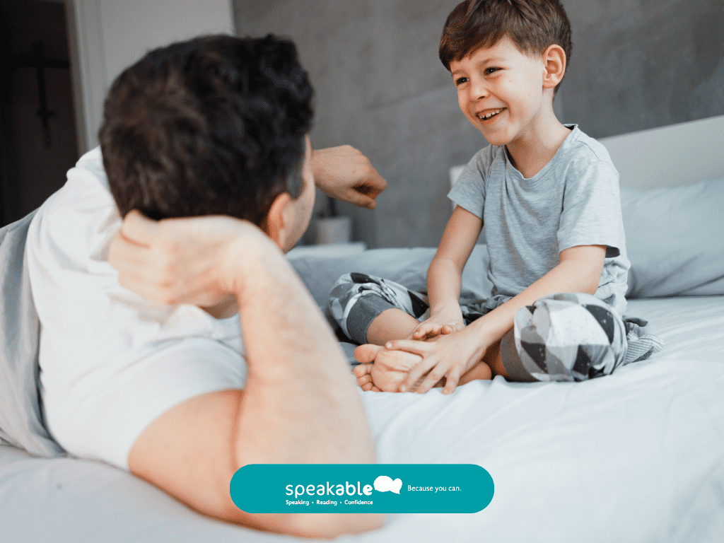 Child engaging in speech therapy while using visual supports to express ideas.