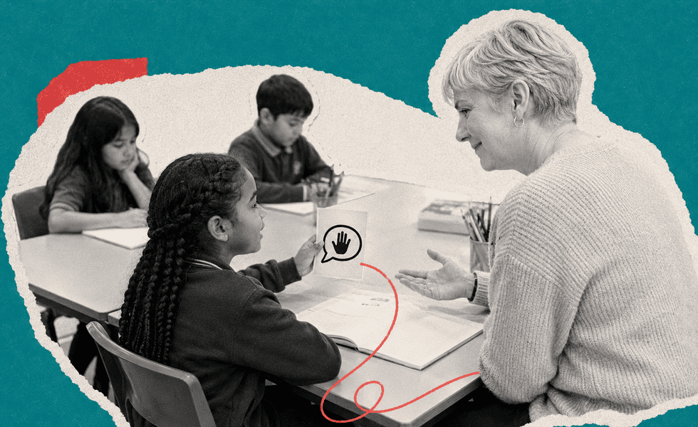 Student using a visual help card during a classroom learning activity.
